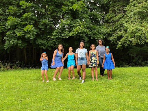 A joyful gathering of children enjoying a sunny day in the park.