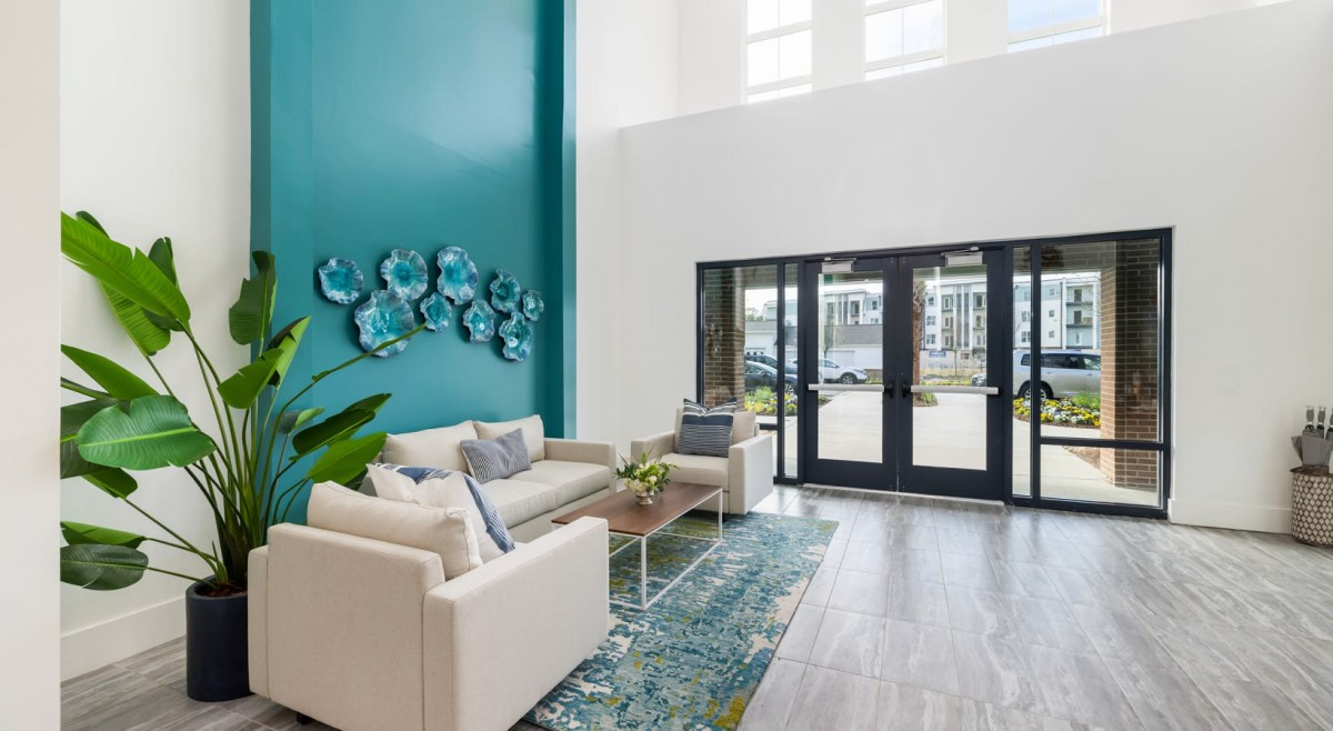 A modern living room with stylish decor and comfortable seating.