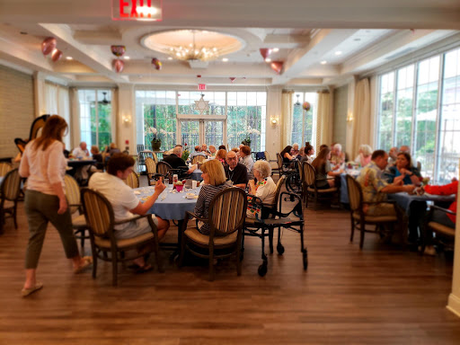 A lively dining area filled with people enjoying their meals and conversations.