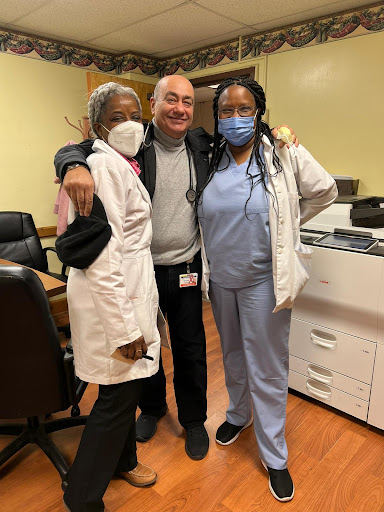 A joyful moment among healthcare professionals in a medical setting.