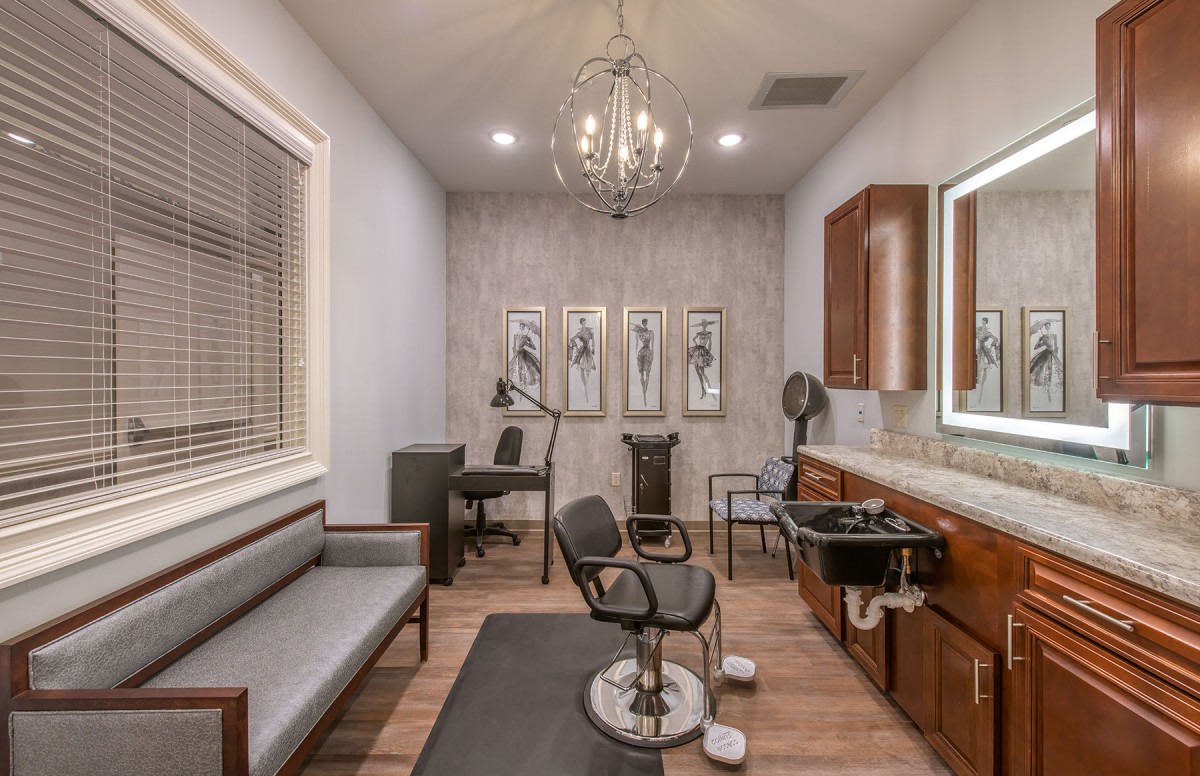 A modern hair salon interior with stylish decor and elegant lighting.