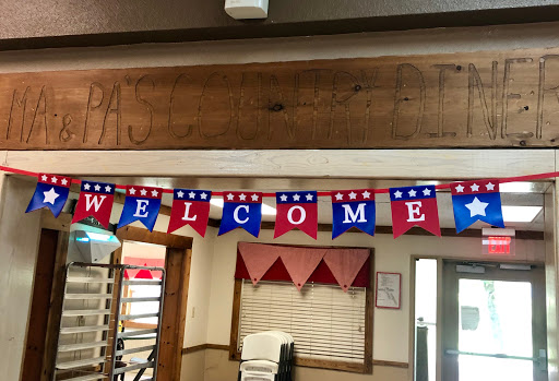 A festive welcome banner displaying red, white, and blue decorations.