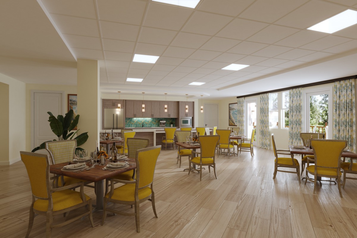 A bright and spacious dining area with yellow chairs, wooden floors, and large windows.