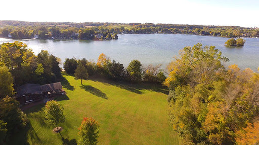 A serene autumn landscape overlooking a tranquil lake.