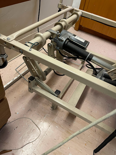 A mechanical component likely from a hospital bed, showcasing its intricate design and functionality.