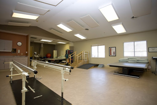 An interior view of a rehabilitation therapy room designed for physical therapy and exercise.