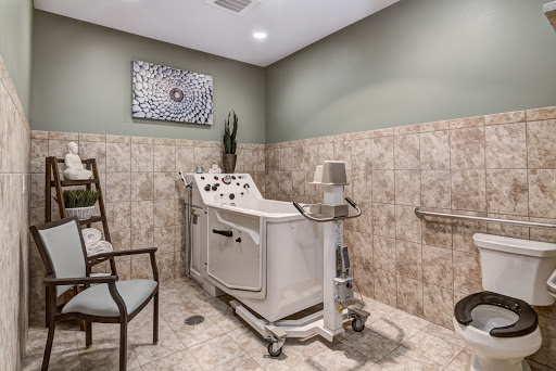 A tranquil spa treatment room featuring specialized medical equipment, designed for relaxation and wellness.