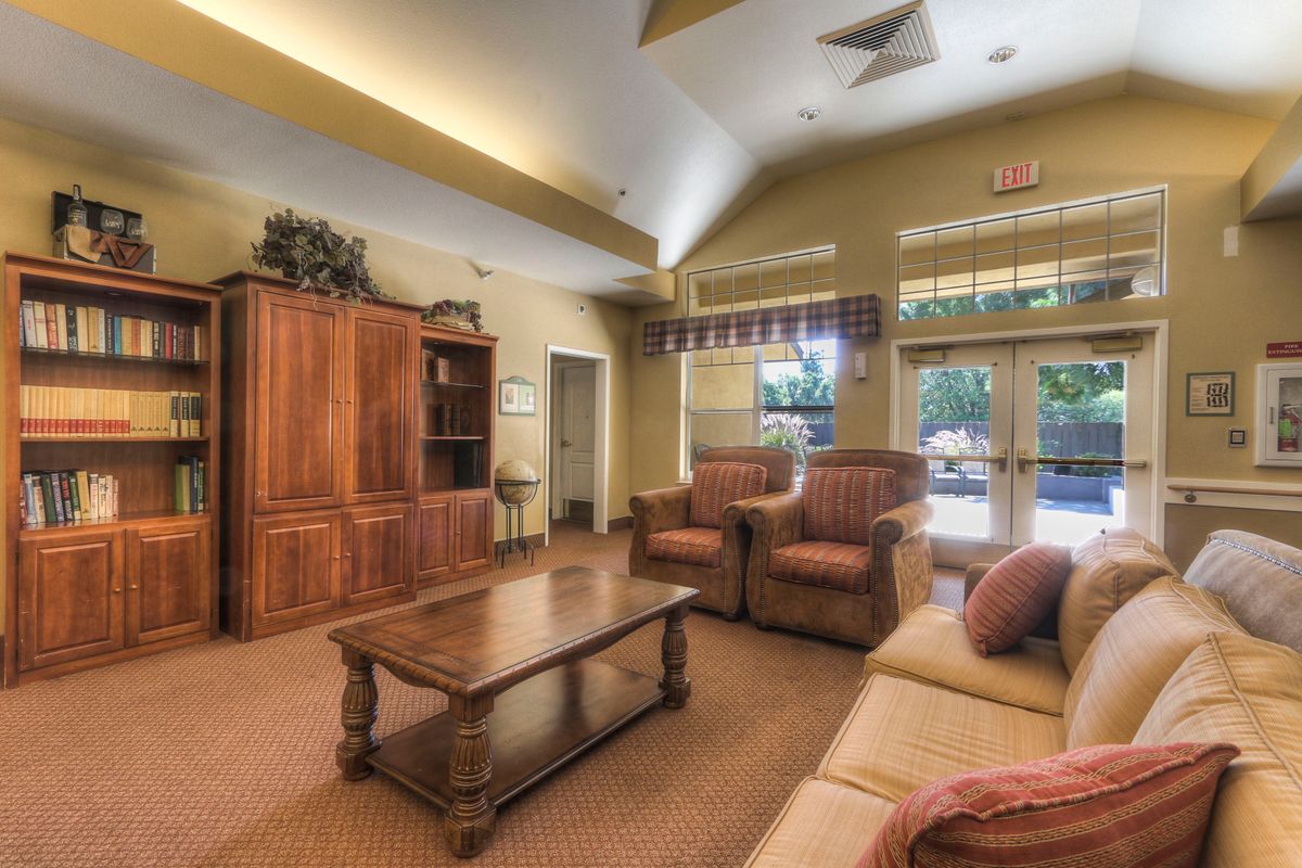 A cozy living room with comfortable seating and wooden furnishings.