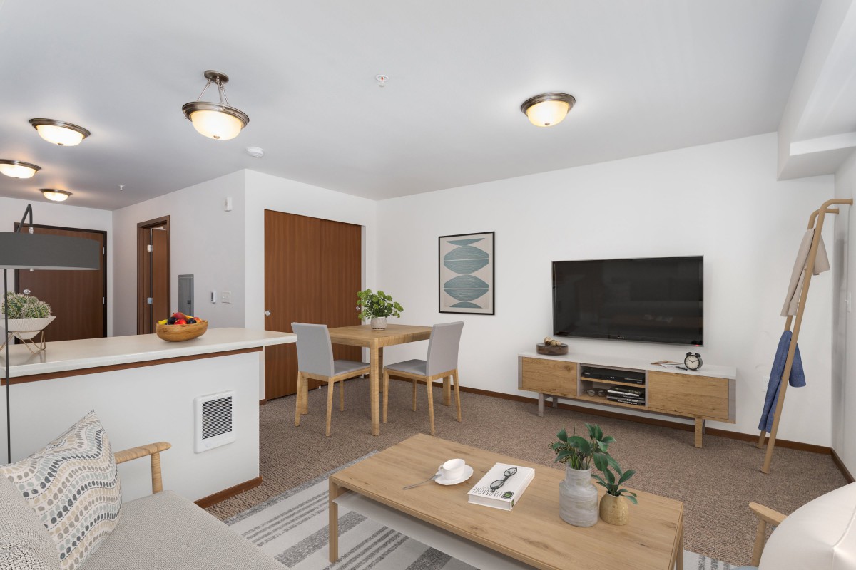 A modern, minimalist living room with a dining area and sleek furniture.