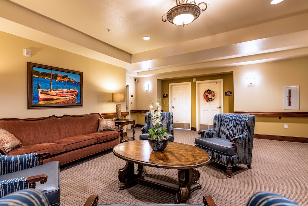 A cozy and well-decorated lobby area with comfortable seating and warm lighting.