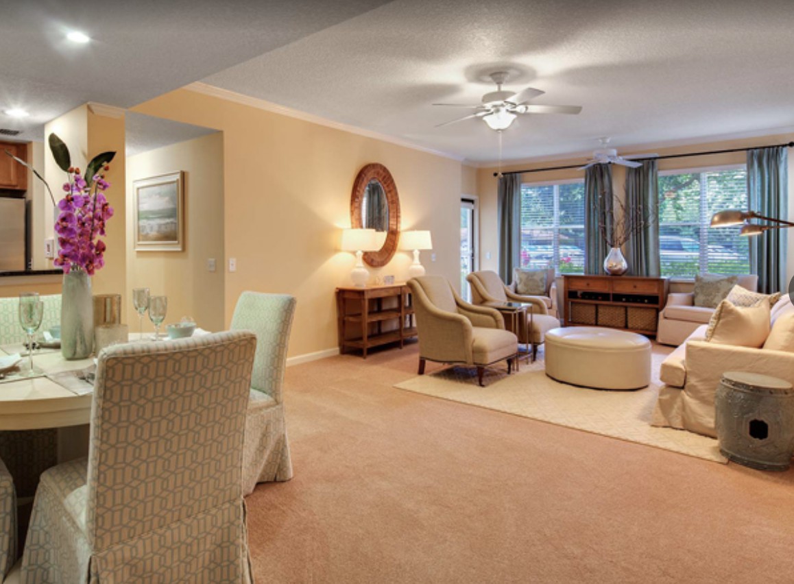 A cozy living room with comfortable seating and elegant decor.