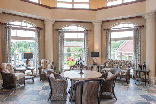 A cozy and elegant living space filled with natural light, featuring stylish furniture and a welcoming atmosphere.