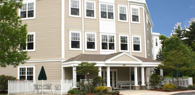 A modern building with large windows and a welcoming entrance.