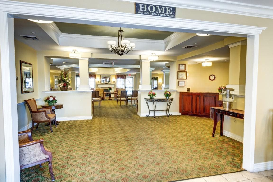 A welcoming lobby area with elegant decor and a chandelier.