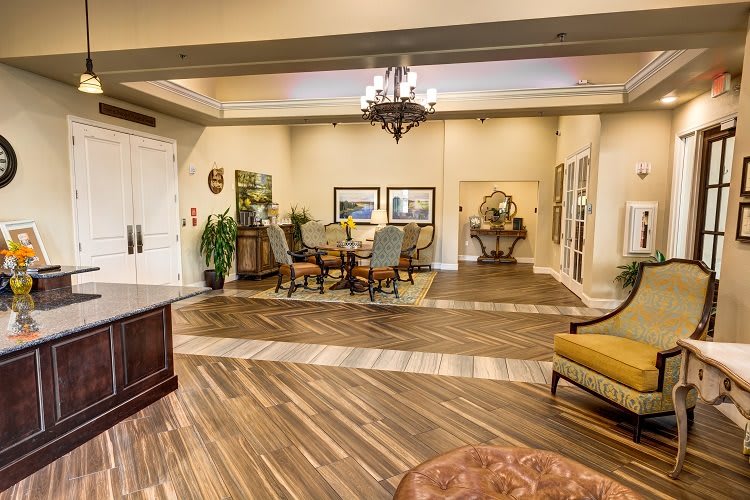 A spacious lobby area featuring elegant furniture and decor.