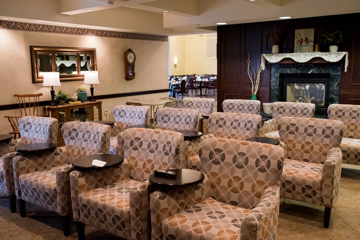 A cozy seating area with patterned chairs arranged in rows, ideal for a lobby or waiting room setting.