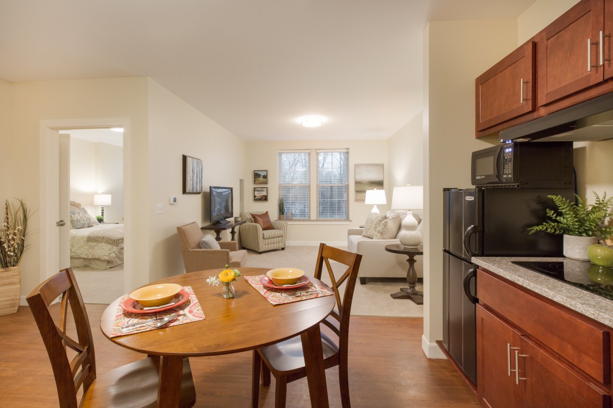 Cozy apartment interior with a dining area and living room.