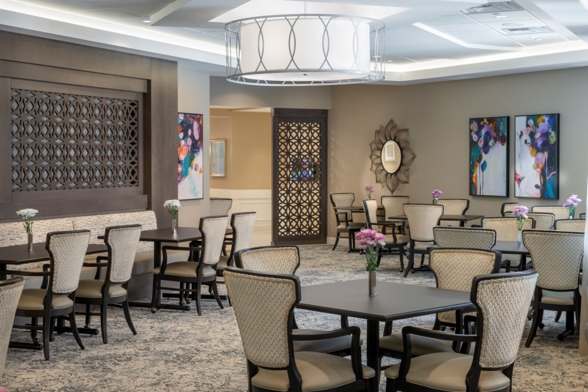 A modern dining area with elegant furniture and decor.