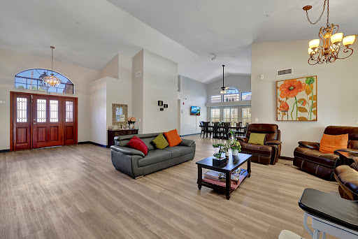 A bright and inviting living room featuring modern furniture and a cozy atmosphere.
