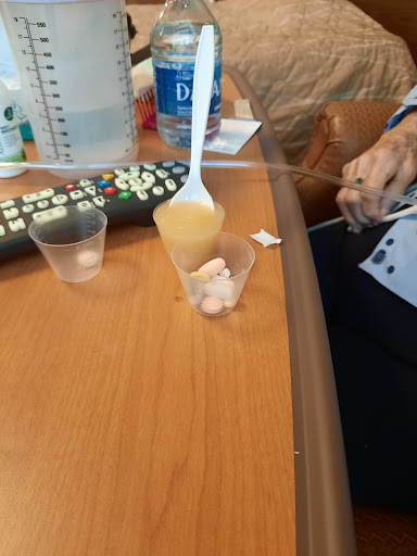 A close-up view of snacks being prepared on a table, possibly in a hospital setting.