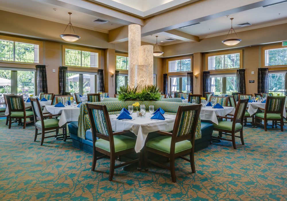 A beautifully set dining area with elegantly arranged tables and comfortable seating.