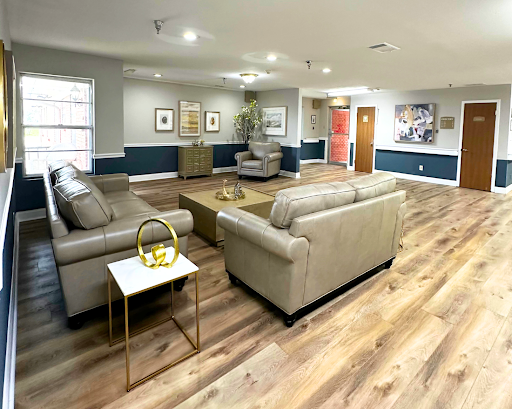 A cozy and modern living room setting featuring comfortable seating and stylish decor.