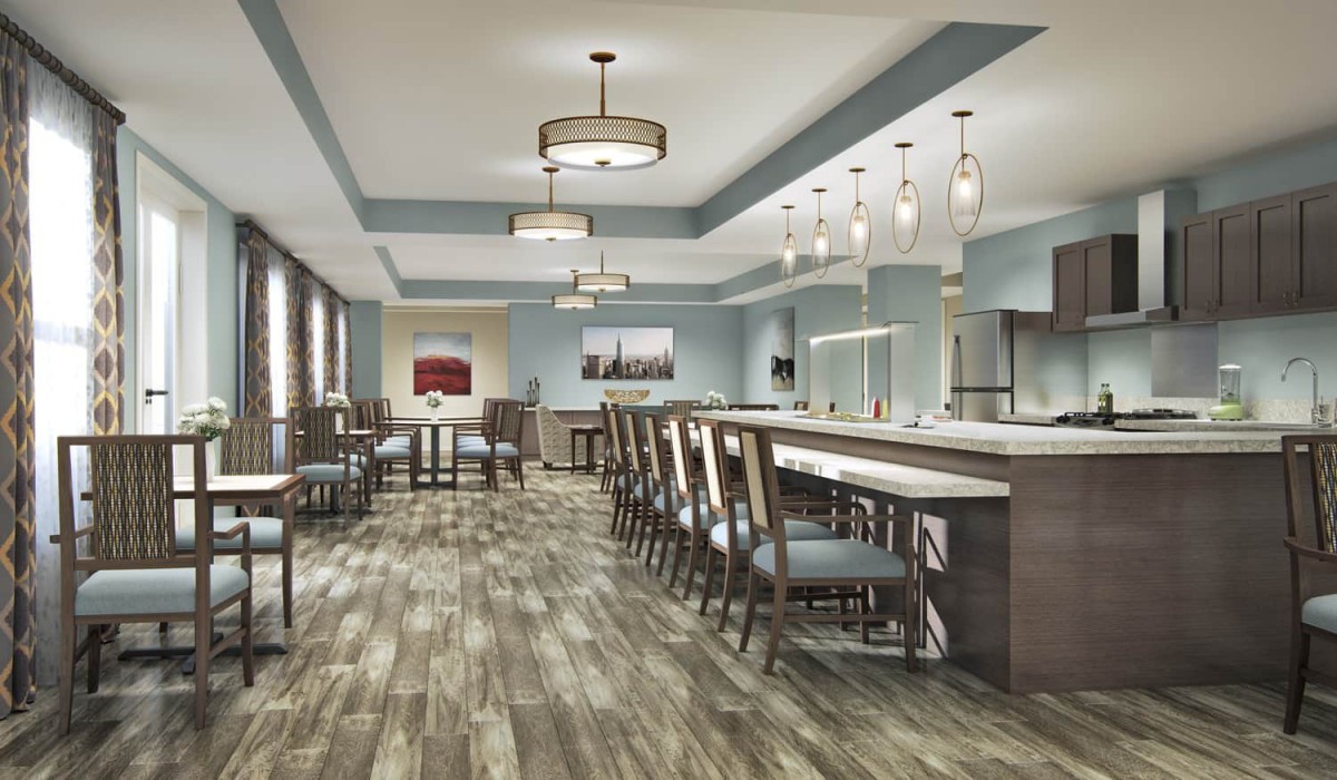 A modern dining area with a long bar counter and contemporary lighting.