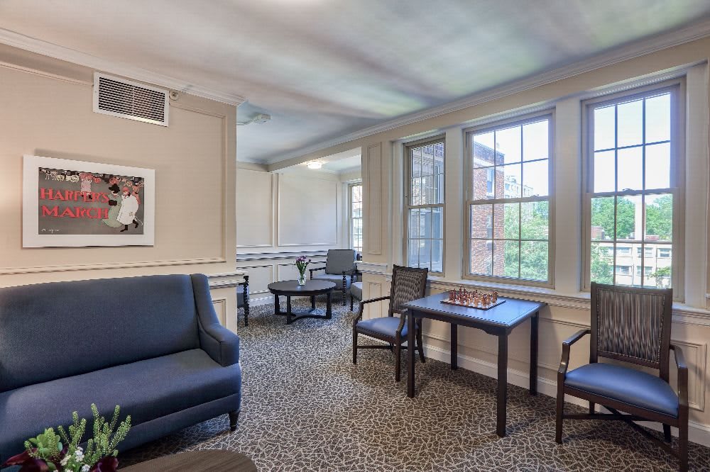 A cozy living room with comfortable seating and ample natural light.