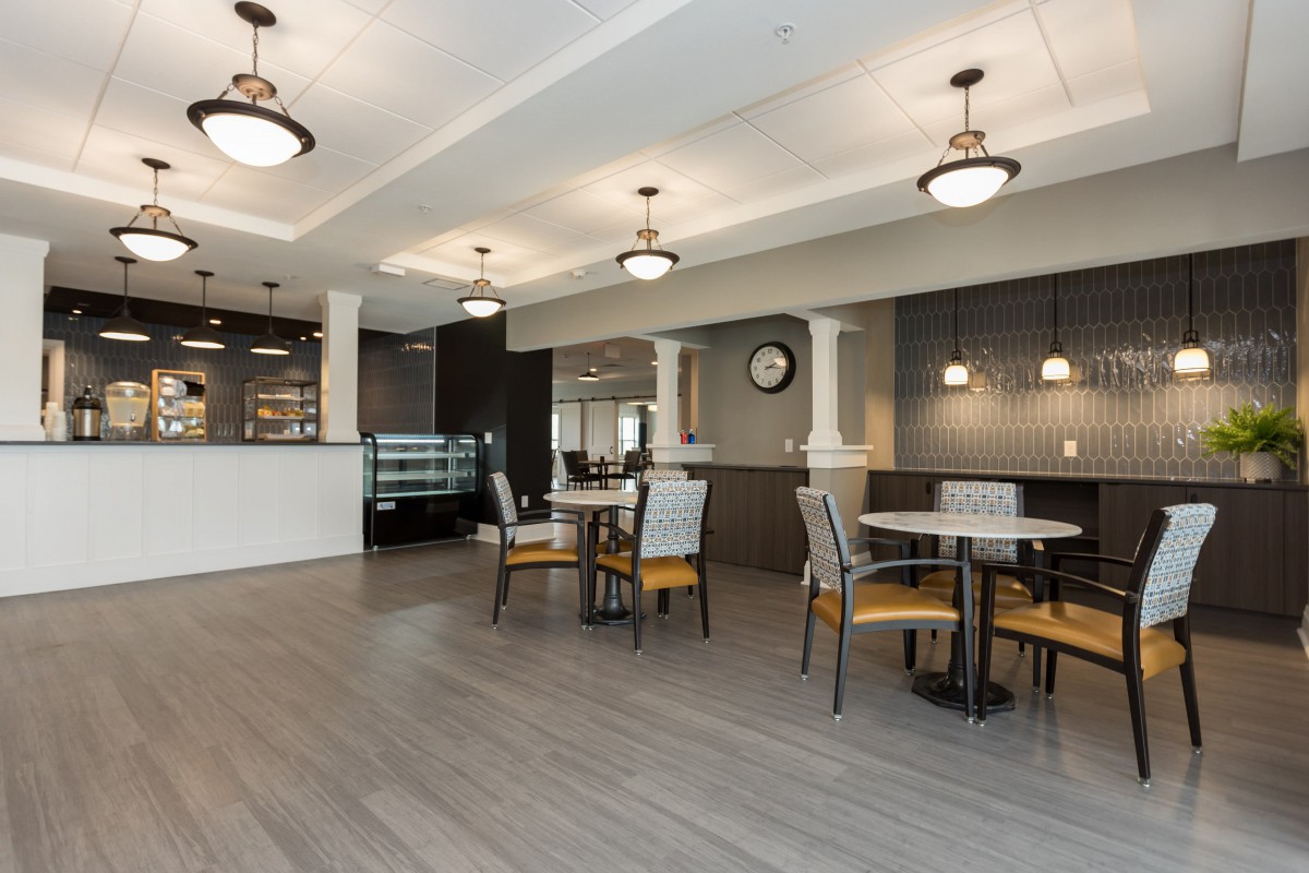 A modern cafe interior with comfortable seating and stylish design.