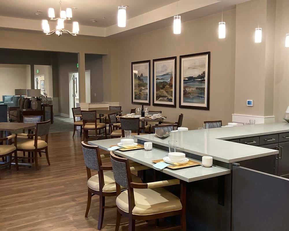 A modern restaurant interior with elegant lighting and comfortable seating.