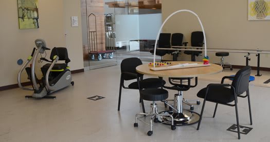 A modern waiting area with a round table and chairs.