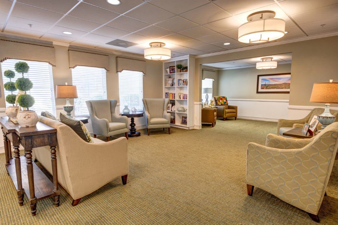 A cozy living room with comfortable seating and soft lighting.
