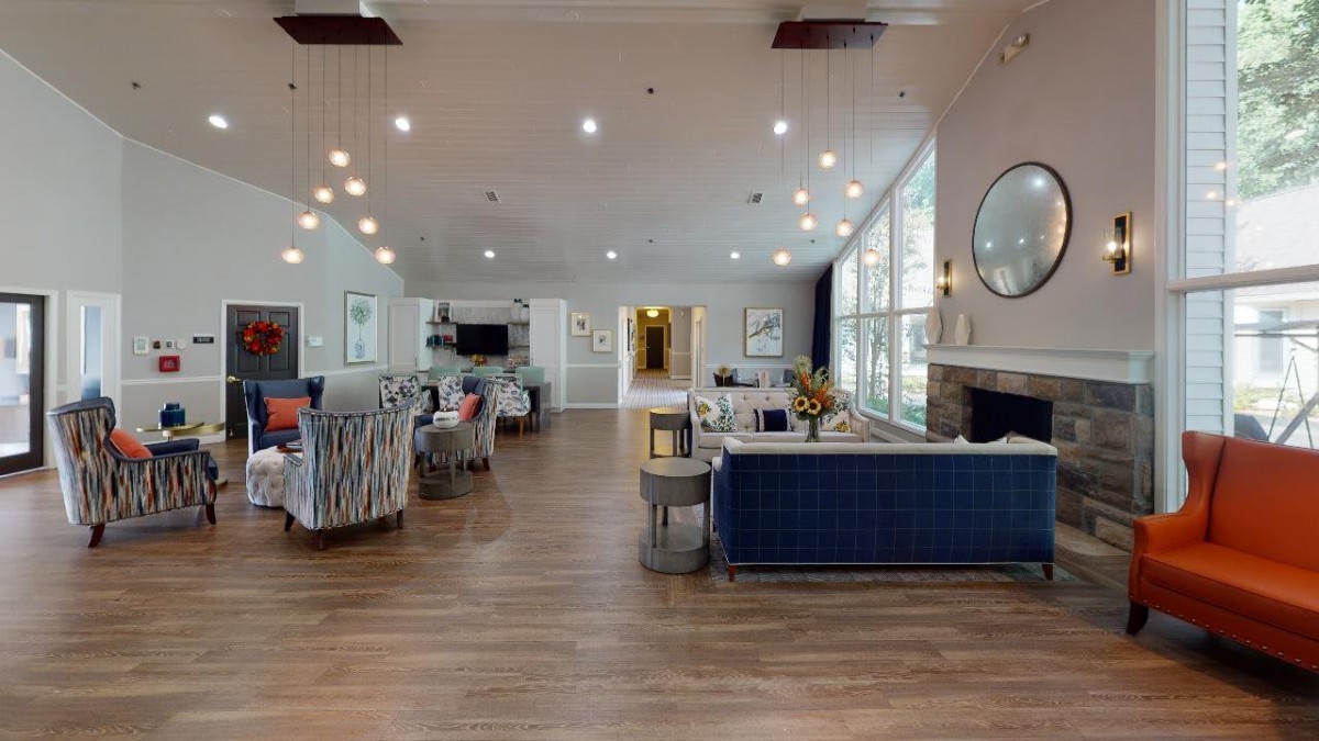 A spacious and modern lounge area with comfortable seating, stylish decor, and ample natural light.
