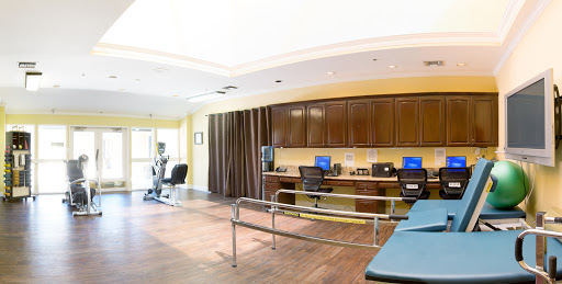 A spacious and well-equipped rehabilitation therapy room designed for patient comfort and effective treatment.