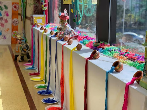 A vibrant display of colorful crafts and decorations in a classroom setting.