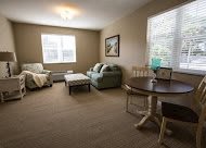 A cozy living room with comfortable seating and natural lighting.