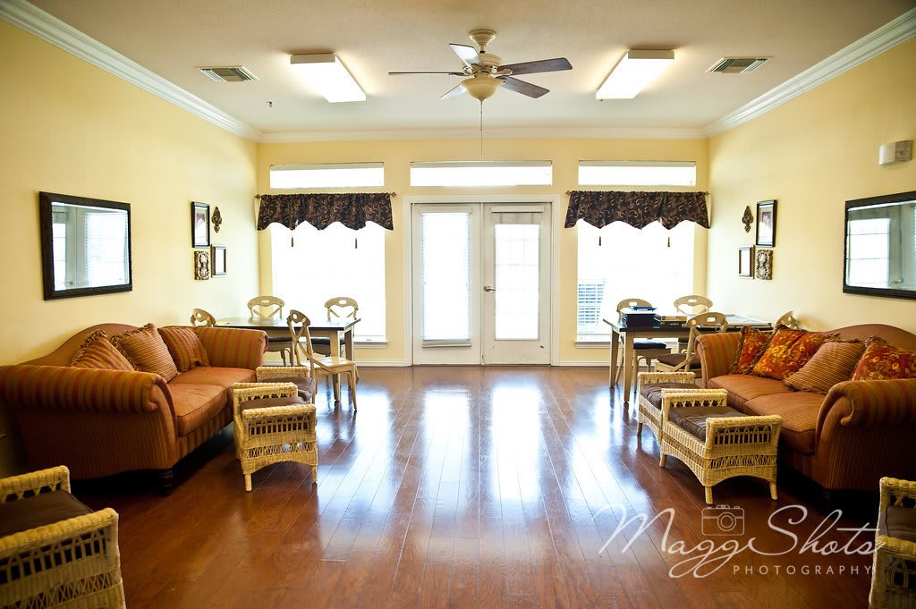 A spacious living room with comfortable seating and ample natural light.