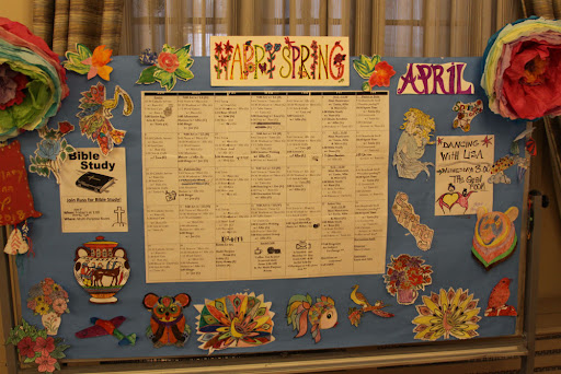 A vibrant spring-themed educational display highlighting events and activities for April.