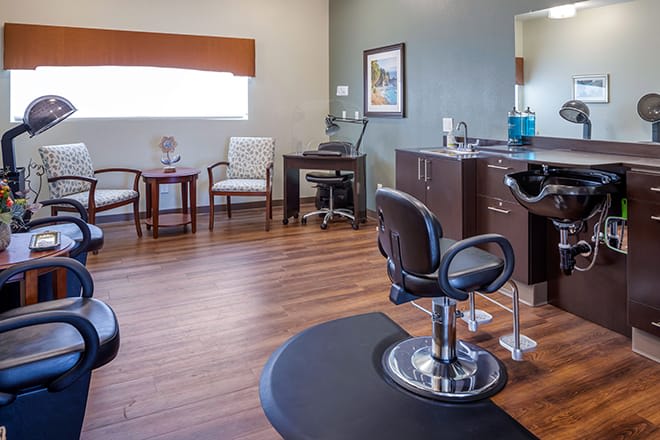 A modern hair salon interior with chairs and stylish furnishings.