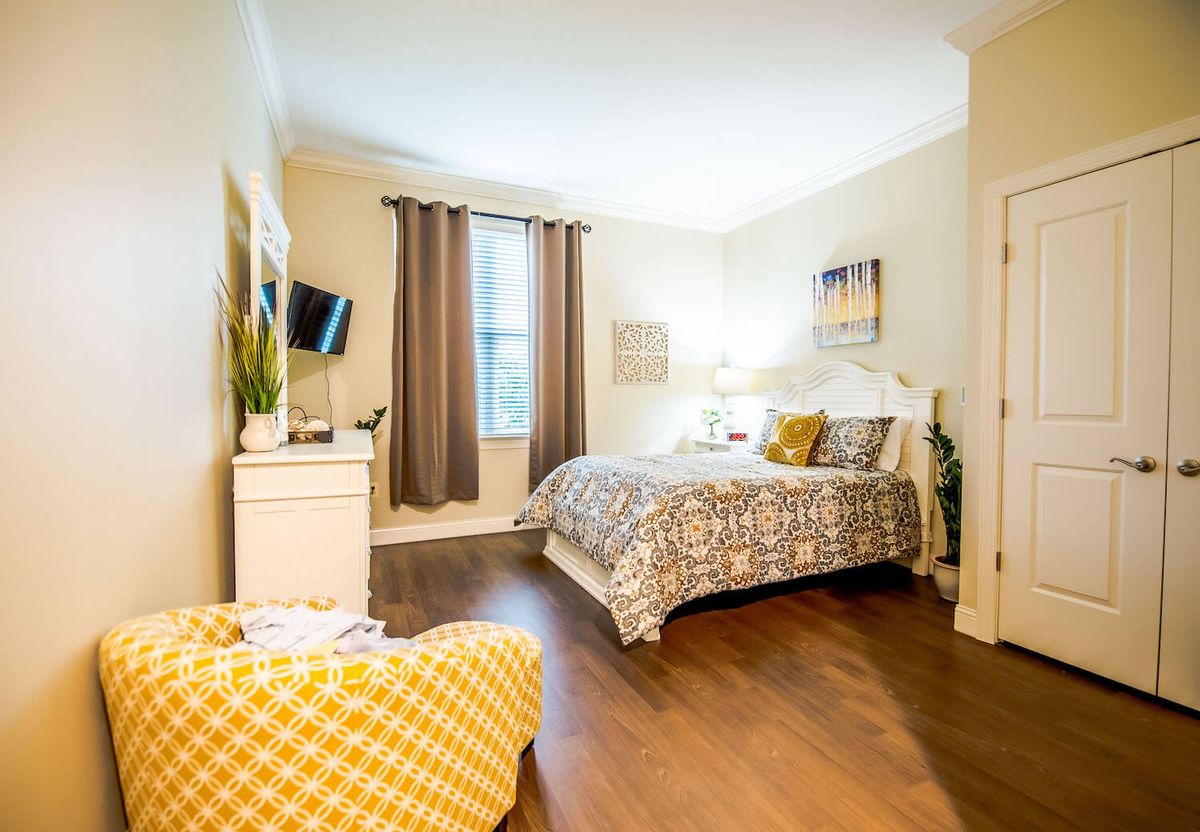A cozy, modern bedroom with stylish decor and furniture.