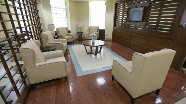 A modern living room with comfortable seating and a central coffee table.