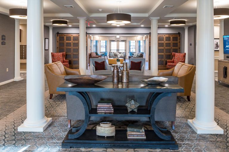 A luxurious and modern living room with comfortable seating arrangements and stylish decor.