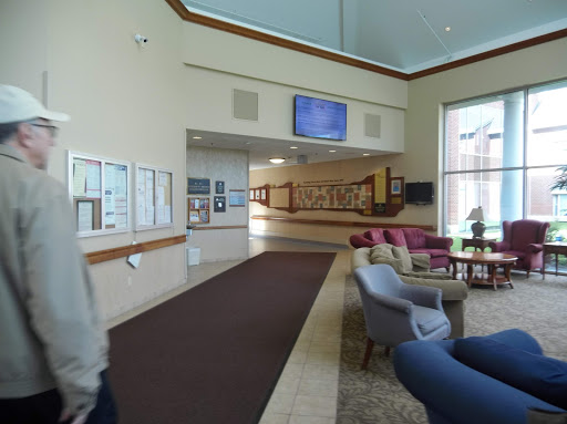 A spacious lobby featuring comfortable seating and modern decor.