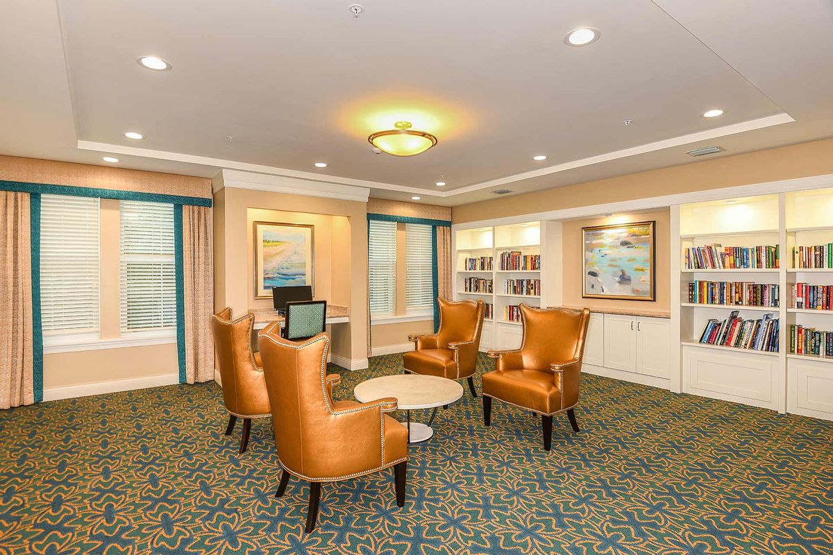 A cozy lounge area with comfortable seating and warm lighting.