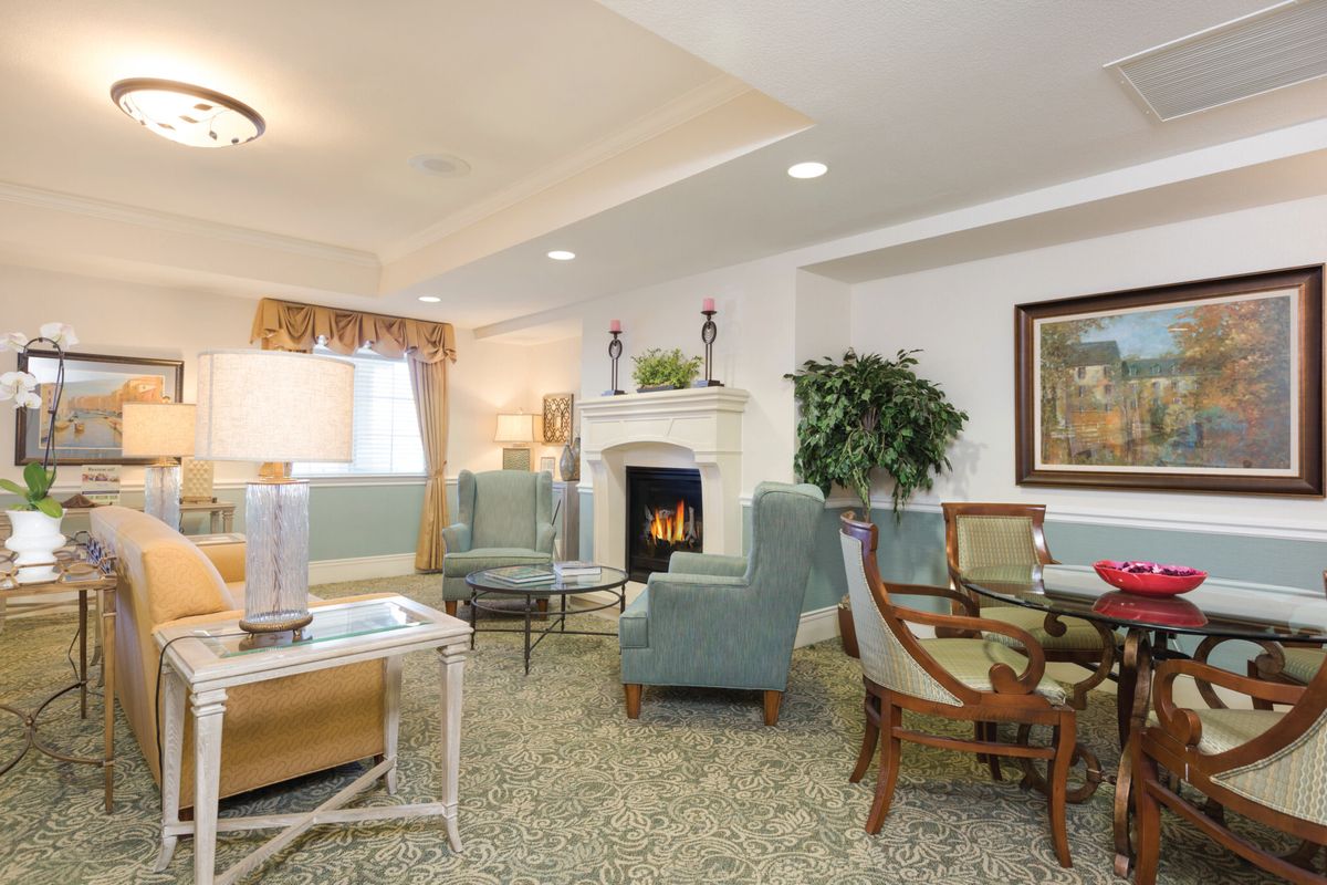 A cozy living room with elegant furniture and a fireplace.
