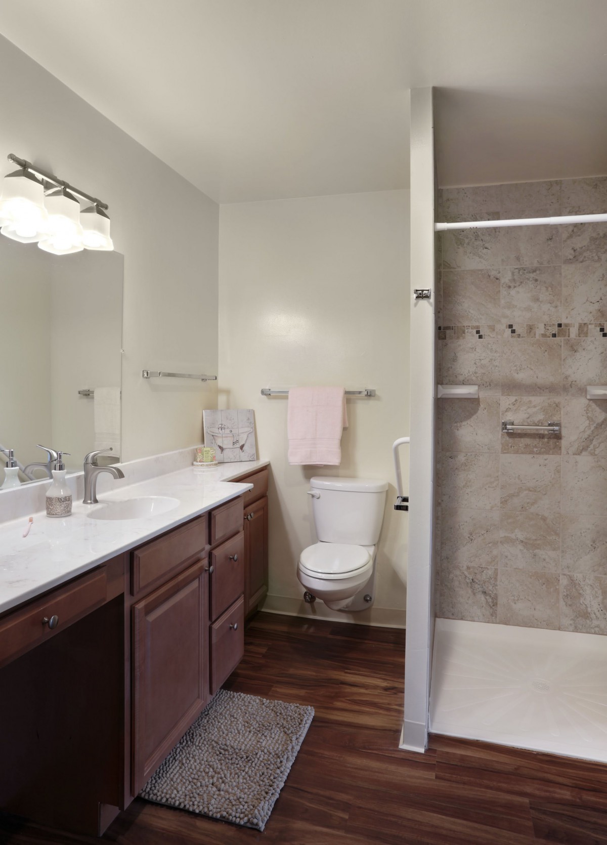 Modern bathroom with a double sink and walk-in shower.