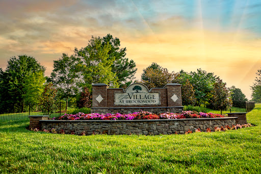 Welcome to a picturesque park, beautifully landscaped with vibrant flowers and greenery.