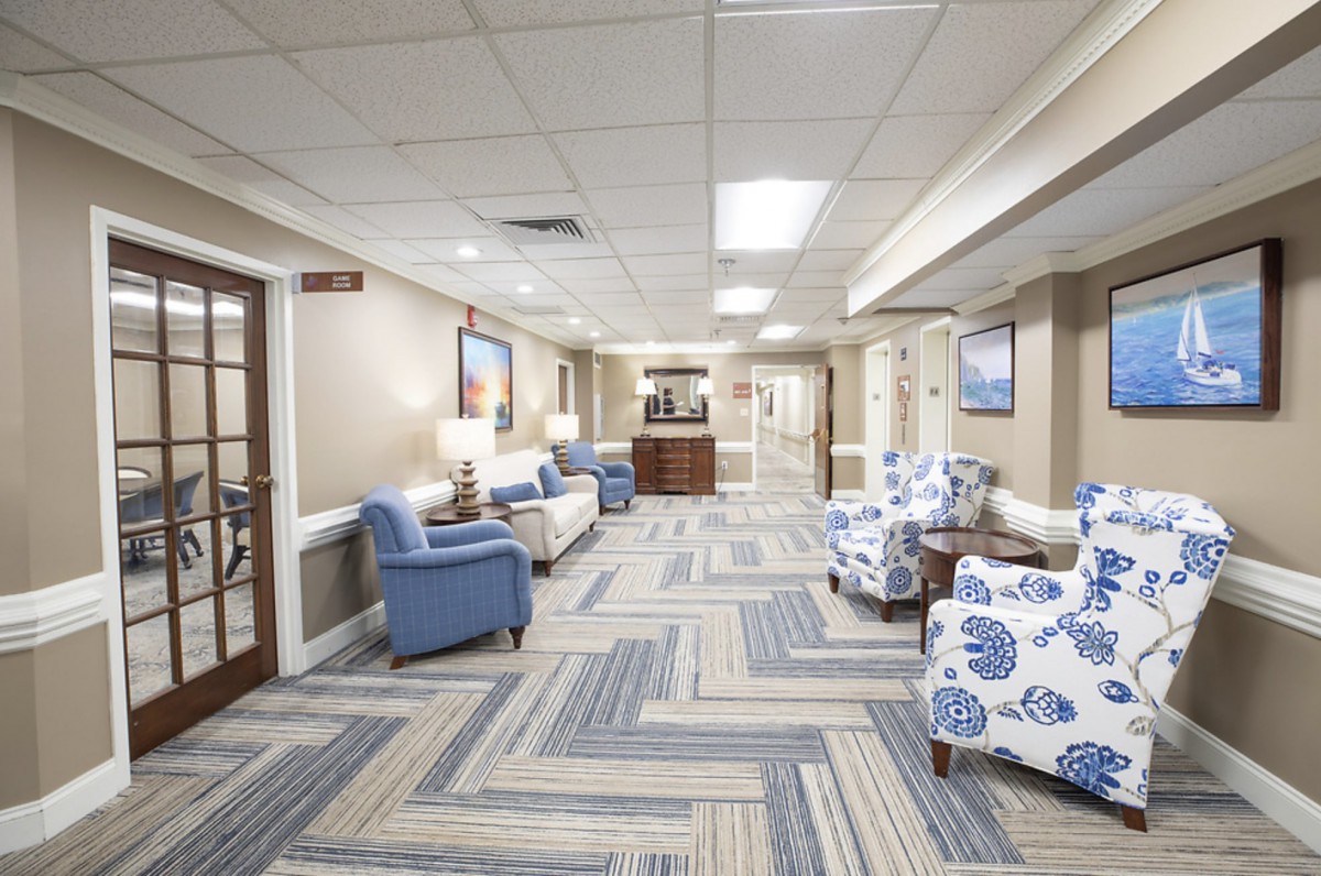 A modern and well-lit lobby area with comfortable seating and stylish decor.