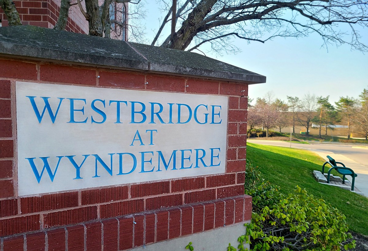 Entrance sign for Westbridge at Wyndemere surrounded by landscaping.