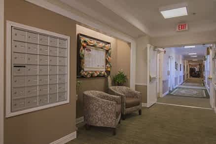 A quiet hallway with seating and decorative elements.
